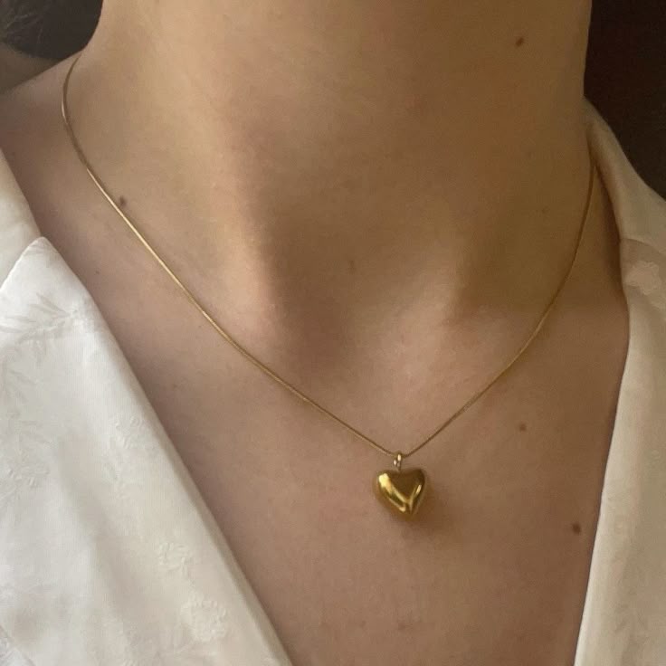 dainty heart necklace on girl